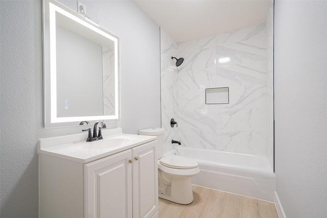 bathroom with vanity, tub / shower combination, wood finished floors, and toilet