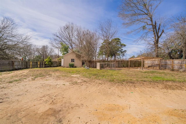 view of yard featuring a fenced backyard and an outdoor structure