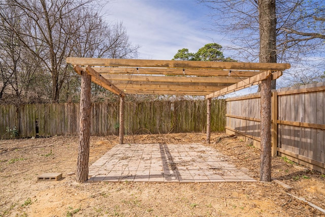 view of yard with a patio area, a fenced backyard, and a pergola