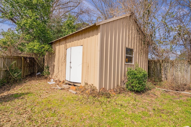 view of shed featuring a fenced backyard