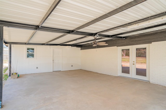 garage with metal wall and french doors