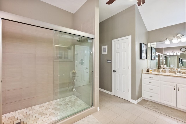 bathroom with ceiling fan, a shower stall, vanity, and tile patterned floors