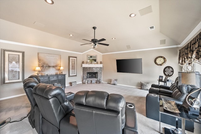 carpeted living room featuring lofted ceiling, baseboards, a fireplace, and visible vents