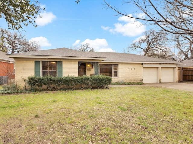 single story home with concrete driveway, brick siding, a front lawn, and an attached garage