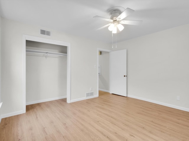 unfurnished bedroom featuring light wood finished floors, visible vents, and baseboards