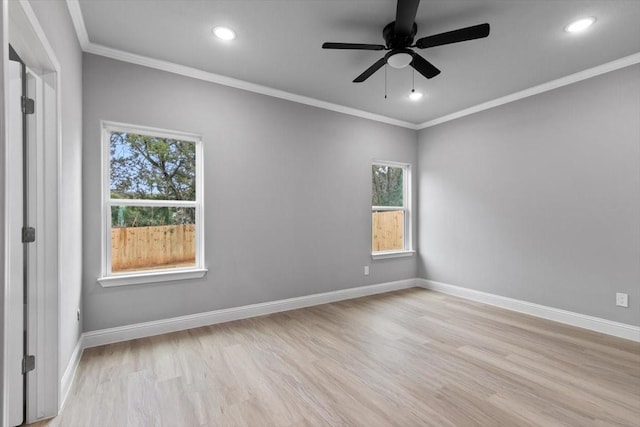 unfurnished room with light wood-style floors, plenty of natural light, and baseboards