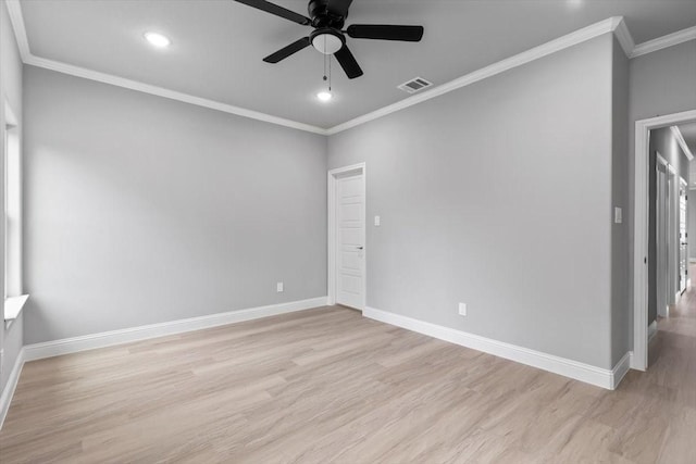 spare room featuring baseboards, visible vents, ornamental molding, light wood-type flooring, and recessed lighting