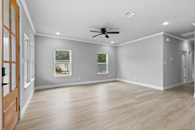 spare room with light wood-type flooring, baseboards, visible vents, and a ceiling fan