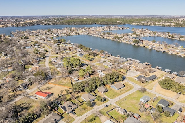 birds eye view of property featuring a water view and a residential view