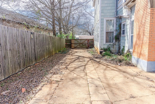 view of patio featuring a gate and fence