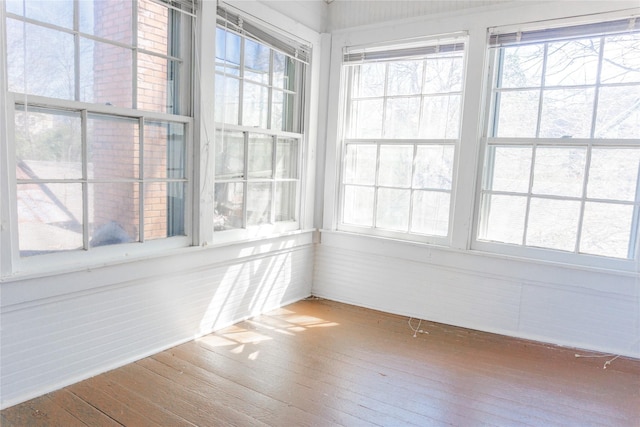 unfurnished sunroom with a wealth of natural light