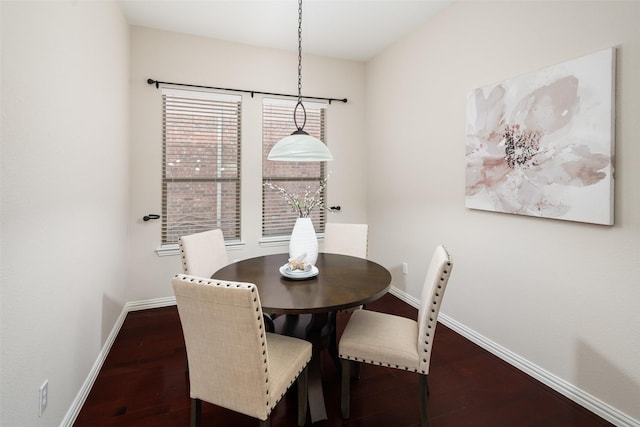 dining space with dark wood-style floors and baseboards