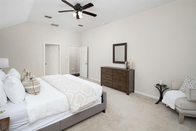 bedroom featuring visible vents, vaulted ceiling, and light colored carpet