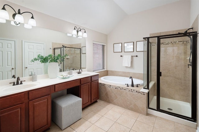 bathroom featuring lofted ceiling, tile patterned floors, a garden tub, a shower stall, and a sink