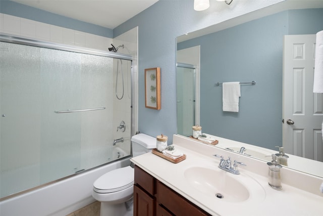 full bath with shower / bath combination with glass door, vanity, and toilet