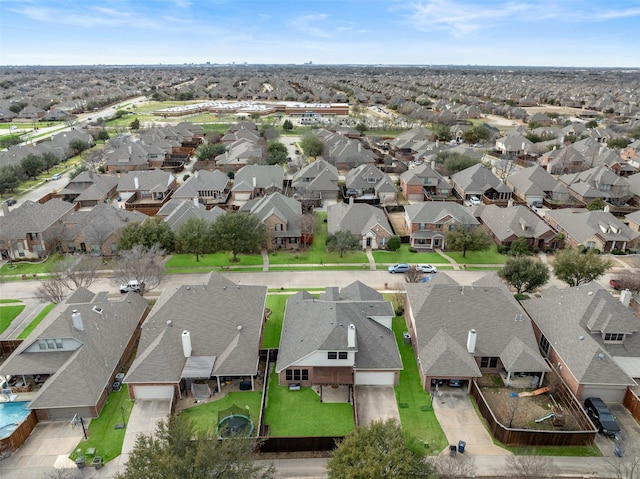 birds eye view of property with a residential view