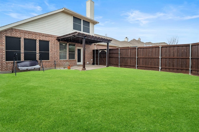 rear view of property with fence private yard, brick siding, a patio, and a pergola