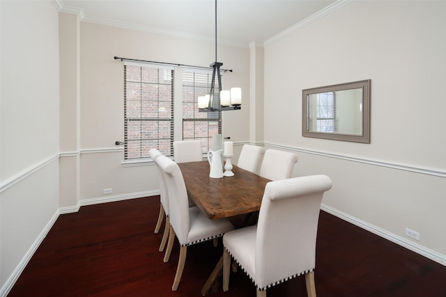 dining room with crown molding, baseboards, a chandelier, and dark wood-style flooring