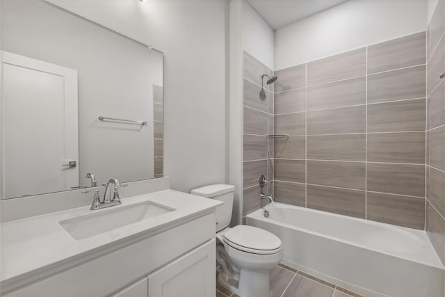 bathroom with toilet, vanity, and shower / bathing tub combination