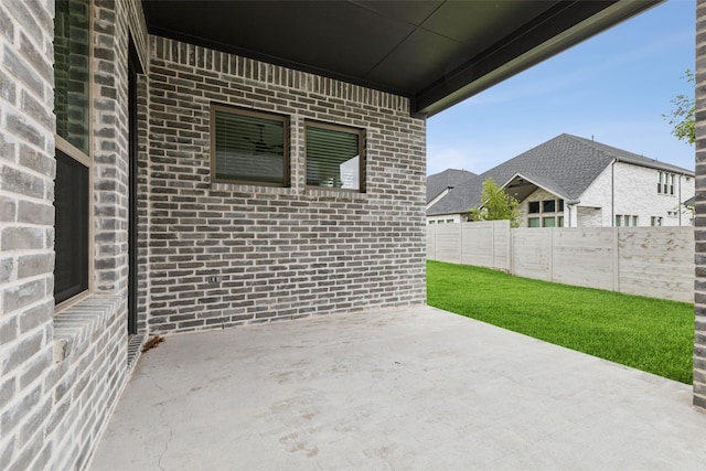 view of patio / terrace featuring fence