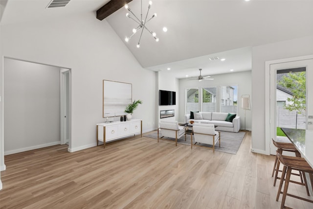 living room featuring visible vents, baseboards, light wood-style floors, high vaulted ceiling, and beam ceiling