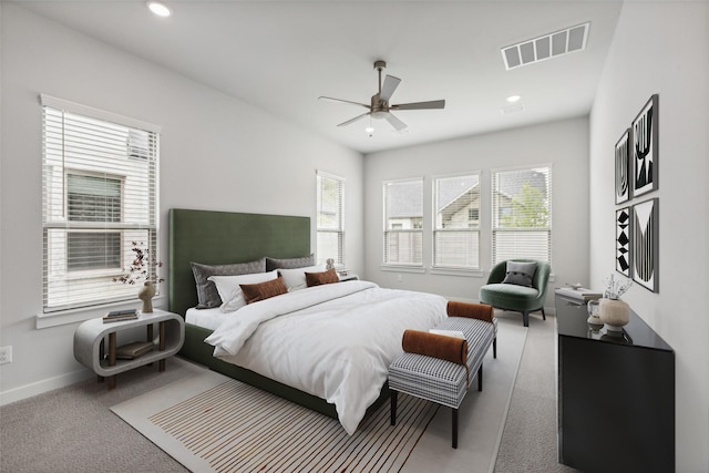 carpeted bedroom featuring baseboards, a ceiling fan, visible vents, and recessed lighting