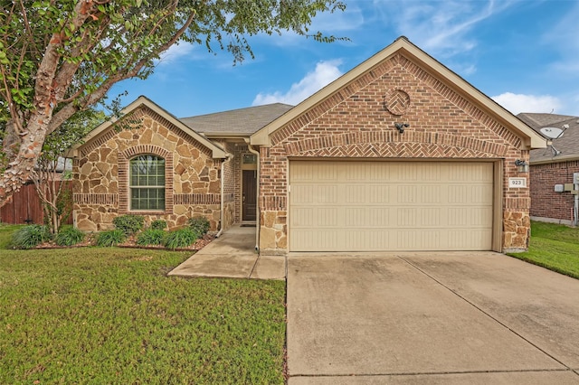 single story home featuring driveway, a garage, stone siding, a front lawn, and brick siding