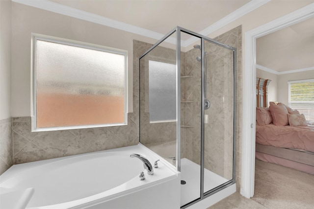 ensuite bathroom with a stall shower, ornamental molding, a bath, and ensuite bathroom