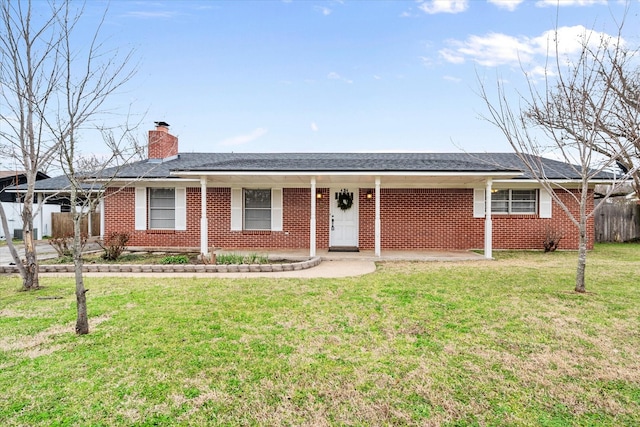 single story home with a shingled roof, a chimney, fence, a front yard, and brick siding