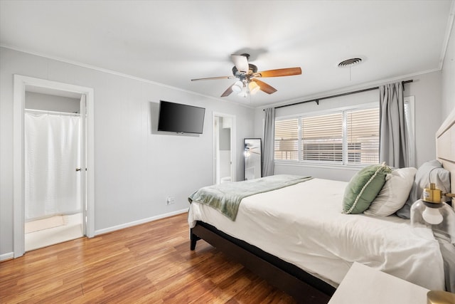 bedroom featuring a ceiling fan, baseboards, visible vents, light wood finished floors, and crown molding