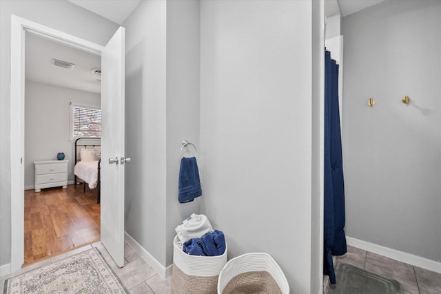 full bath featuring baseboards, visible vents, and tile patterned floors