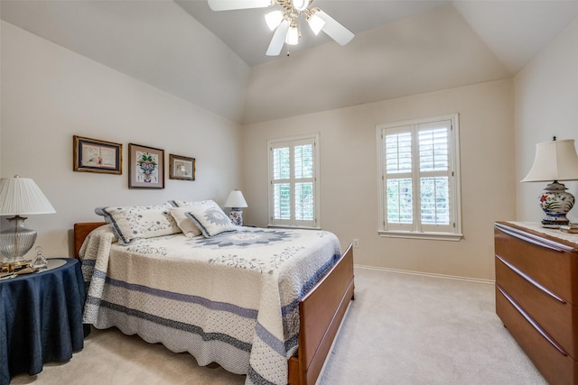 bedroom featuring light carpet, ceiling fan, lofted ceiling, and baseboards