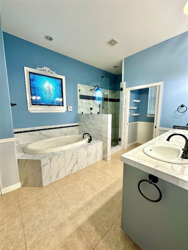 bathroom featuring a stall shower, tile patterned flooring, visible vents, and a bath