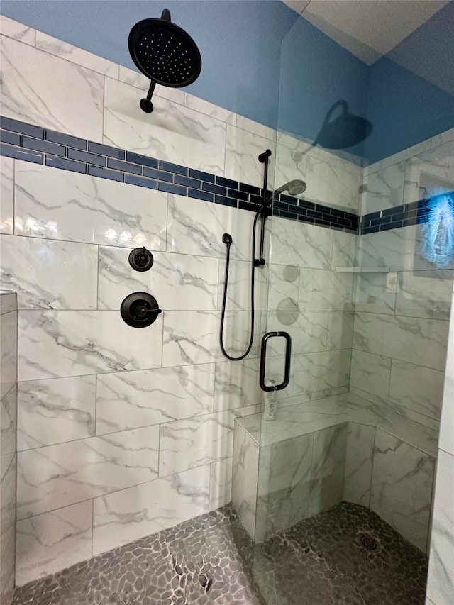 bathroom with a shower stall