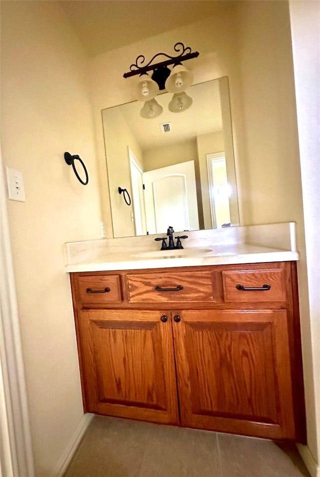 bathroom featuring tile patterned flooring, visible vents, and vanity