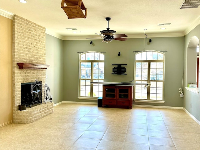 unfurnished living room featuring plenty of natural light, visible vents, and crown molding