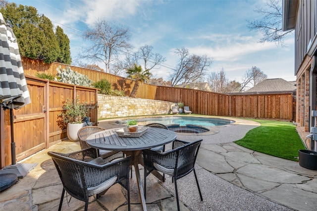 view of patio featuring outdoor dining area and a fenced backyard