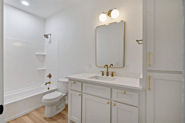 full bathroom featuring shower / bath combination, vanity, toilet, and wood finished floors