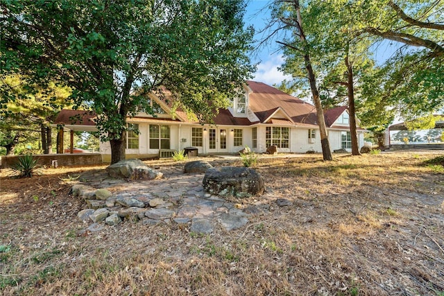 back of property featuring a patio and french doors