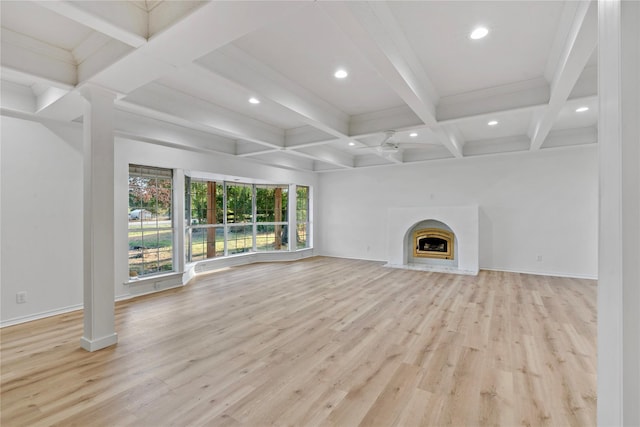 unfurnished living room with recessed lighting, a fireplace, coffered ceiling, light wood finished floors, and beamed ceiling