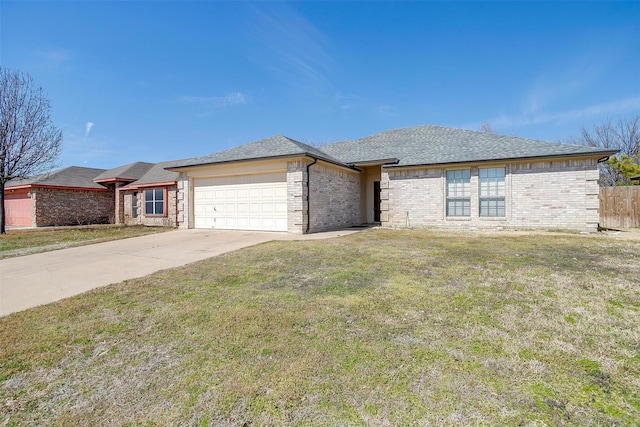 view of front of home featuring brick siding, concrete driveway, an attached garage, a front yard, and fence