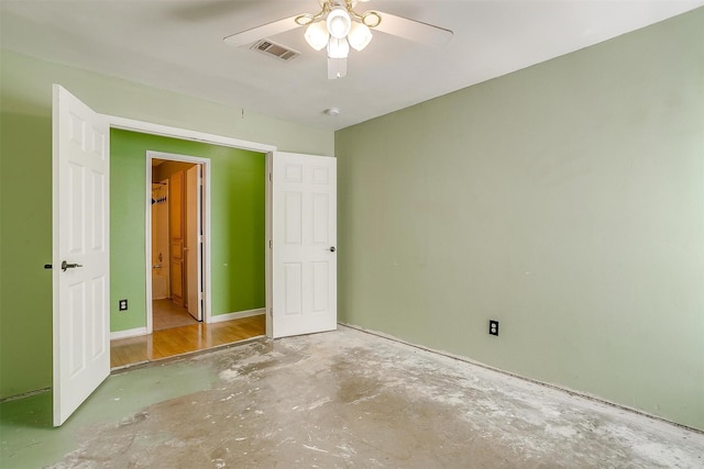 unfurnished bedroom with a ceiling fan, visible vents, and concrete flooring