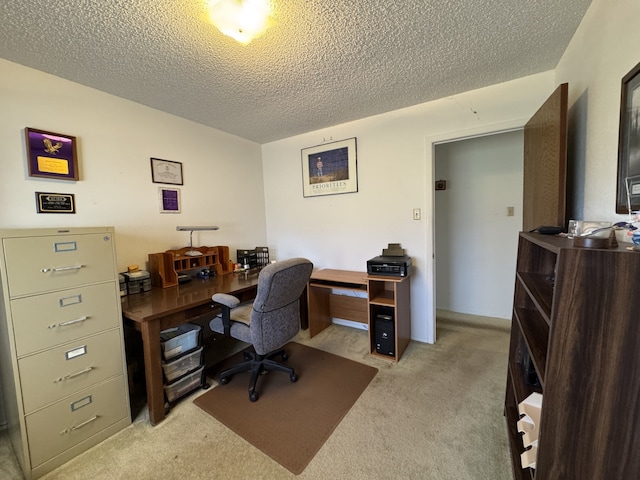 home office featuring light carpet and a textured ceiling