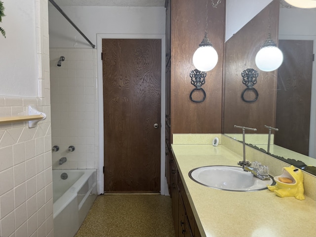 full bathroom featuring shower / washtub combination, tile walls, and vanity