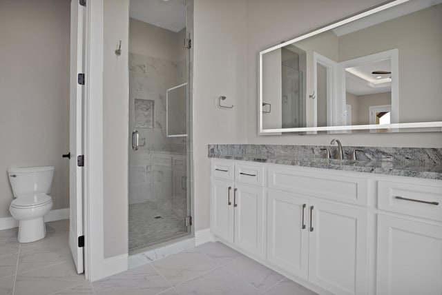 full bath featuring marble finish floor, toilet, a stall shower, vanity, and baseboards