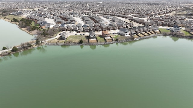 birds eye view of property featuring a residential view and a water view