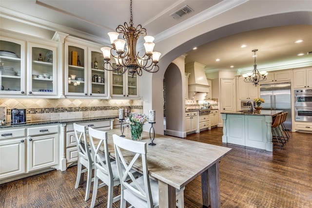 dining room featuring visible vents, arched walkways, crown molding, a notable chandelier, and recessed lighting