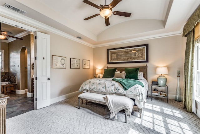 bedroom featuring arched walkways, vaulted ceiling, visible vents, and baseboards