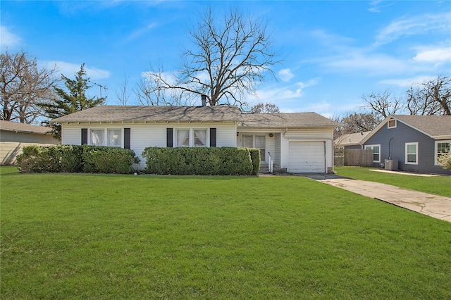 single story home featuring central AC unit, an attached garage, fence, concrete driveway, and a front yard