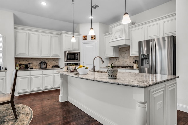 kitchen featuring white cabinets, stainless steel appliances, and dark wood-type flooring